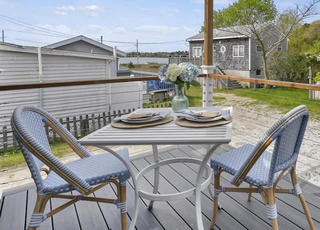 wooden terrace with outdoor dining space