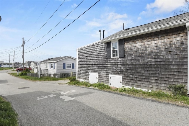 view of property exterior featuring fence