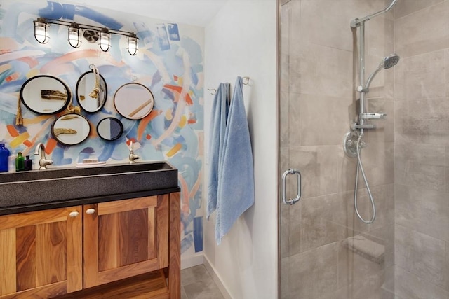 bathroom featuring vanity and an enclosed shower