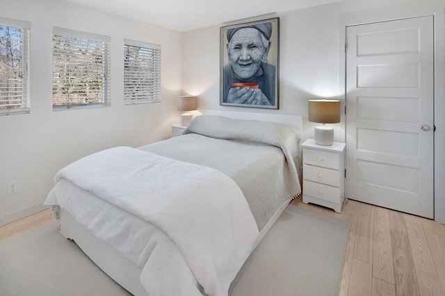 bedroom with light hardwood / wood-style flooring