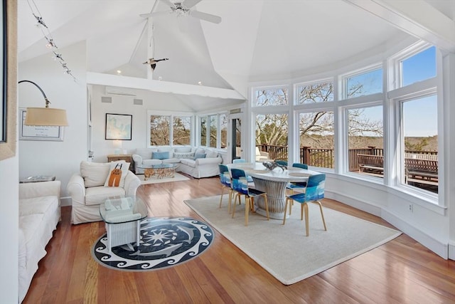 sunroom / solarium with vaulted ceiling and ceiling fan