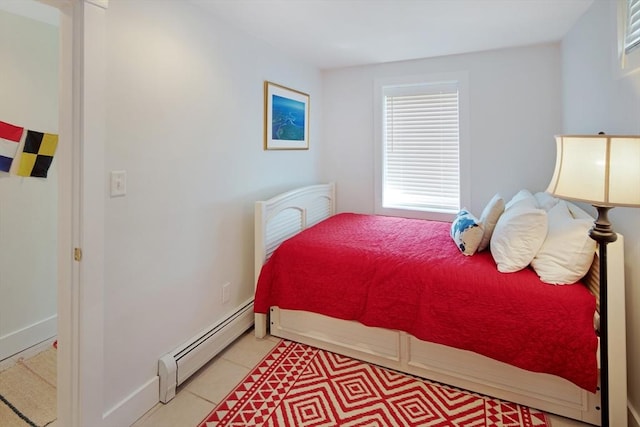 tiled bedroom with a baseboard radiator