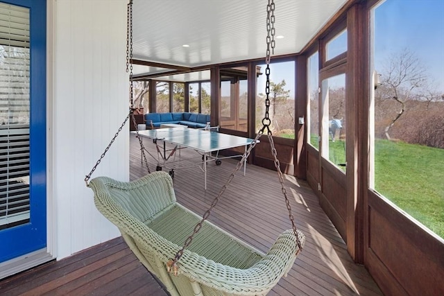 sunroom / solarium featuring a healthy amount of sunlight