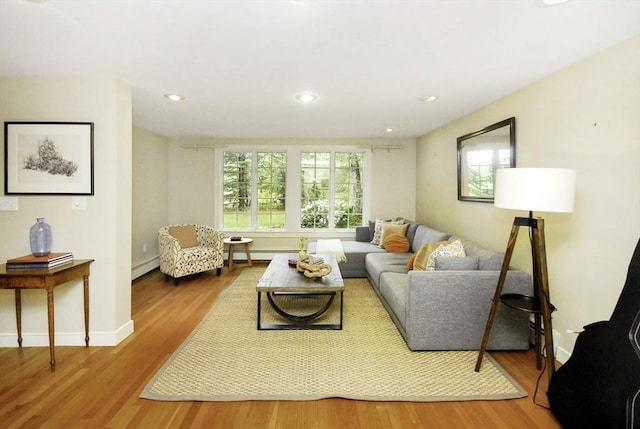 1074 Concord Rd, Sudbury, MA 01776 - living area with a baseboard radiator, wood finished floors, baseboard heating, and recessed lighting