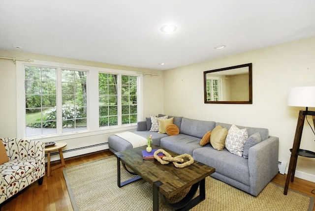 1074 Concord Rd, Sudbury, MA 01776 - living area with a baseboard radiator, wood finished floors, and recessed lighting