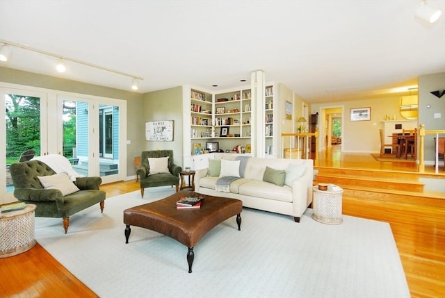 1074 Concord Rd, Sudbury, MA 01776 - living area featuring wood finished floors and track lighting