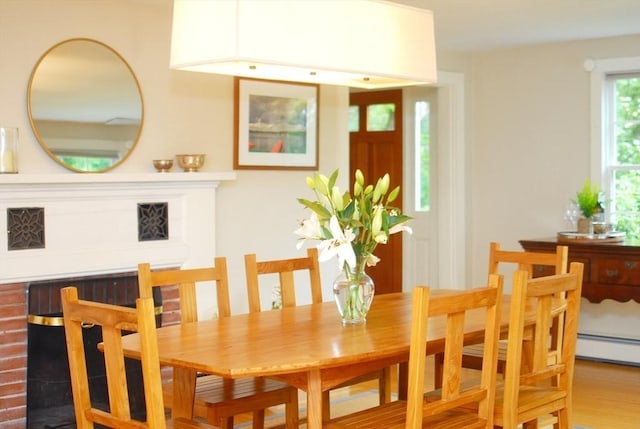 1074 Concord Rd, Sudbury, MA 01776 - dining space with wood finished floors and a baseboard heating unit