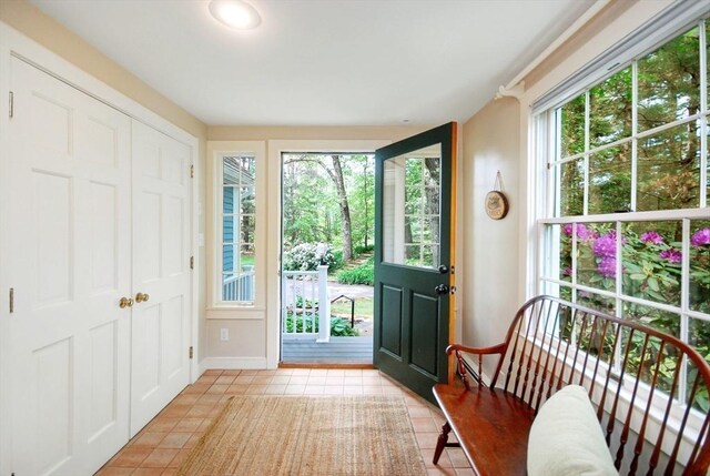1074 Concord Rd, Sudbury, MA 01776 - entryway featuring light tile patterned flooring and baseboards