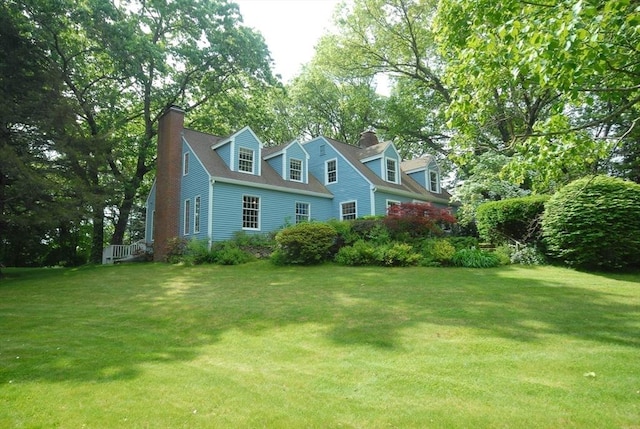 1074 Concord Rd, Sudbury, MA 01776 - view of front of property featuring a chimney and a front yard