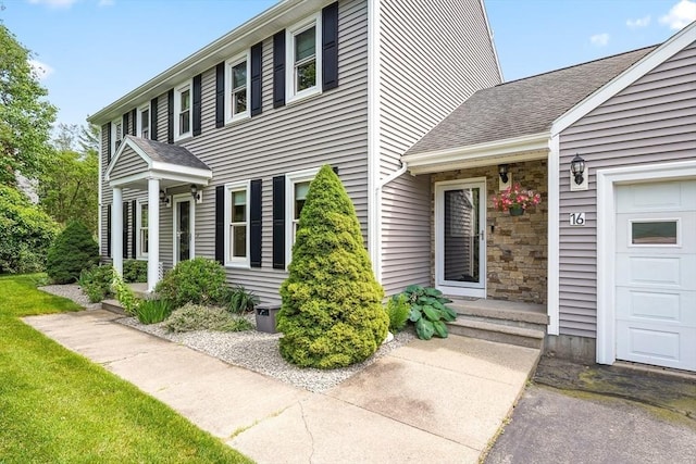 16 Blueberry Way, Webster, MA 01570 - view of side of property with an attached garage and roof with shingles