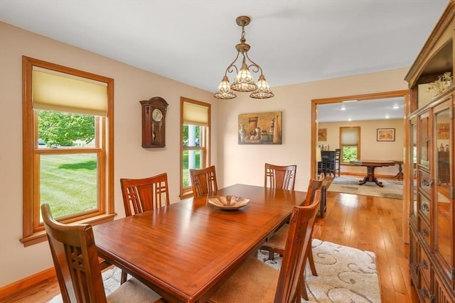 16 Blueberry Way, Webster, MA 01570 - dining space with light wood-style flooring and a chandelier