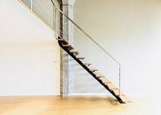 staircase with wood finished floors