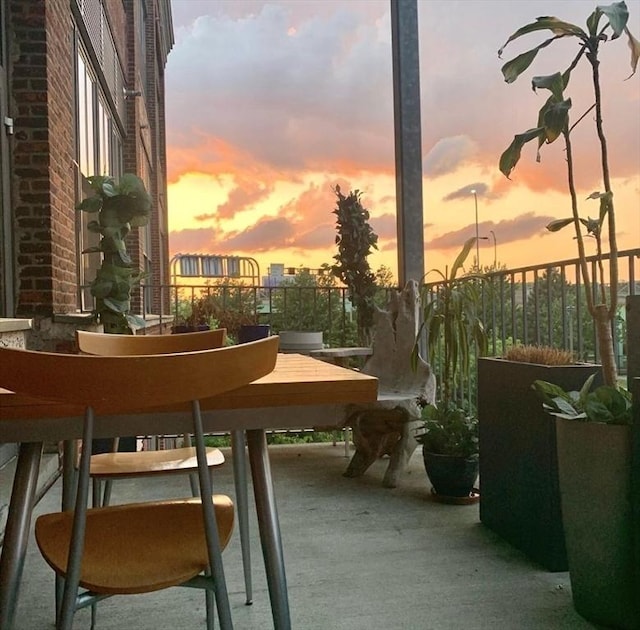 view of patio featuring a balcony