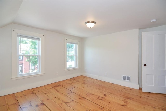 22 Chester Unit 22, Amesbury, MA 01913 - unfurnished room with hardwood / wood-style flooring, baseboards, vaulted ceiling, and a smoke detector