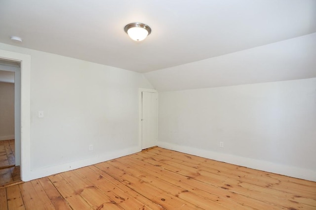 22 Chester Unit 22, Amesbury, MA 01913 - bonus room featuring wood-type flooring, baseboards, and lofted ceiling
