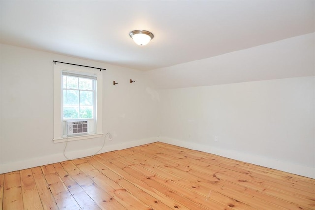 22 Chester Unit 22, Amesbury, MA 01913 - additional living space with cooling unit, hardwood / wood-style flooring, baseboards, and lofted ceiling