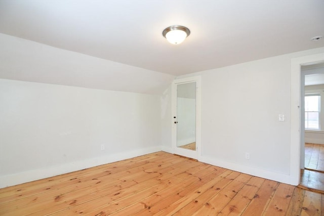 22 Chester Unit 22, Amesbury, MA 01913 - unfurnished room featuring hardwood / wood-style flooring, vaulted ceiling, and baseboards