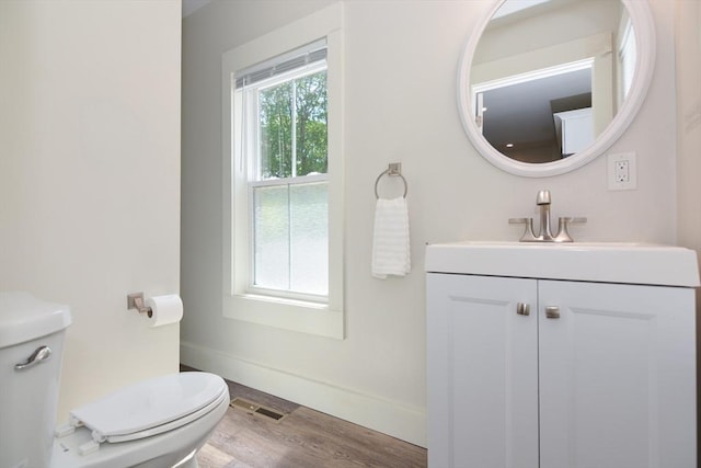 22 Chester Unit 22, Amesbury, MA 01913 - bathroom with toilet, wood finished floors, vanity, and baseboards