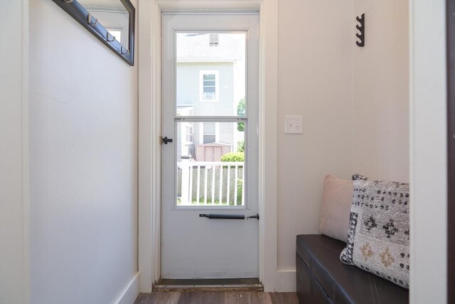 22 Chester Unit 22, Amesbury, MA 01913 - doorway to outside featuring wood finished floors and baseboards