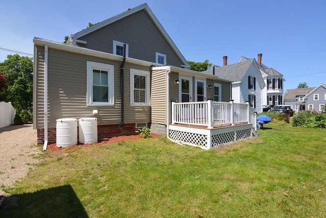 22 Chester Unit 22, Amesbury, MA 01913 - rear view of house with a deck and a lawn