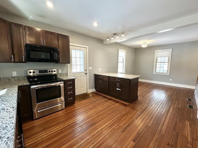 kitchen with black microwave, dark brown cabinetry, a peninsula, dark wood-style flooring, and electric stove