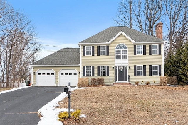 colonial house featuring a garage