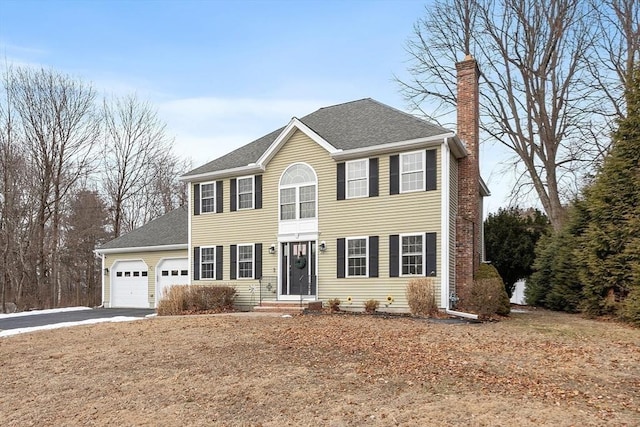 colonial inspired home featuring a garage