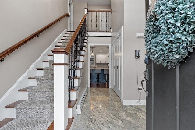 entrance foyer featuring a baseboard radiator