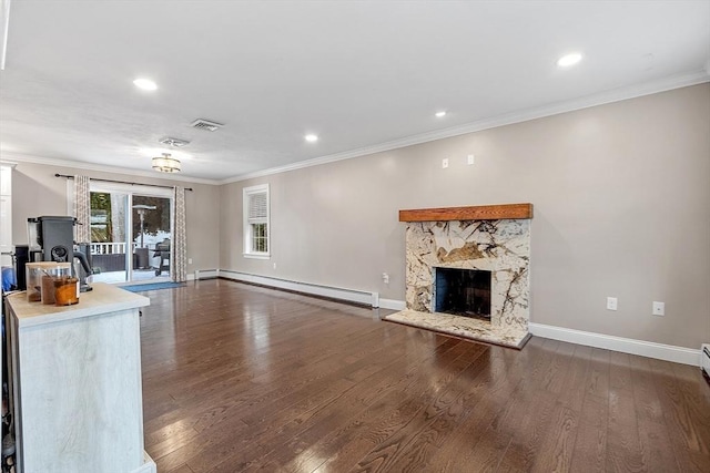 unfurnished living room featuring a baseboard heating unit, a fireplace, dark hardwood / wood-style flooring, and ornamental molding