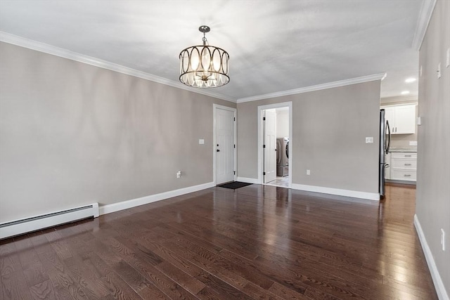 spare room with dark wood-type flooring, a baseboard heating unit, crown molding, and a chandelier