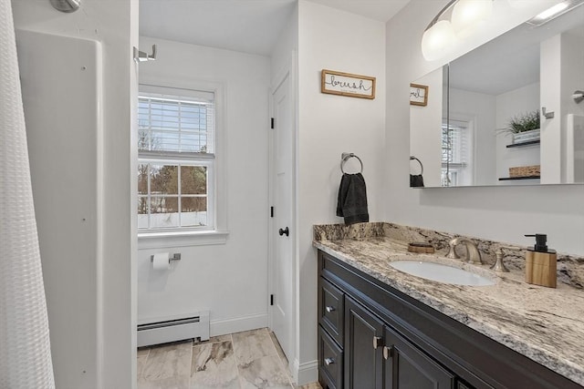 bathroom with vanity and a baseboard radiator