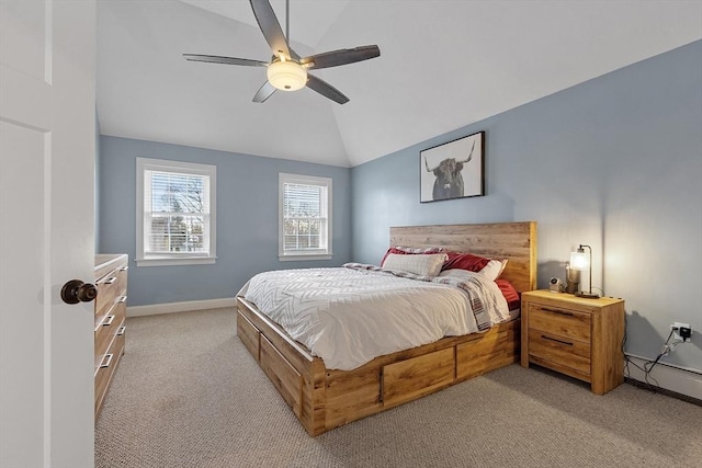 carpeted bedroom featuring ceiling fan, a baseboard radiator, and lofted ceiling