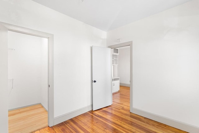 31 Hunting St, Cambridge, MA 02141 - unfurnished bedroom with light wood finished floors