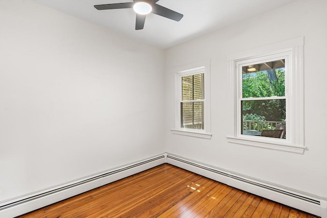 31 Hunting St, Cambridge, MA 02141 - unfurnished room with a baseboard heating unit, a ceiling fan, and wood-type flooring