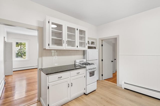 31 Hunting St, Cambridge, MA 02141 - kitchen with white gas range, baseboard heating, and white cabinetry
