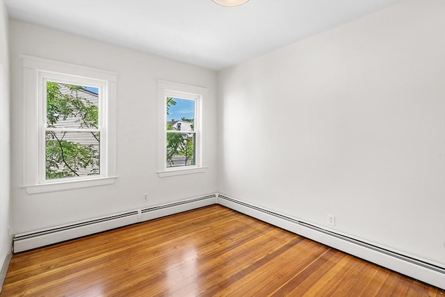 31 Hunting St, Cambridge, MA 02141 - spare room featuring wood finished floors and a baseboard radiator