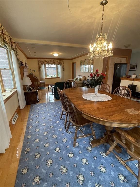 26 Feeney Rd, Norwood, MA 02062 - dining space featuring a chandelier, light wood-style flooring, and ornamental molding