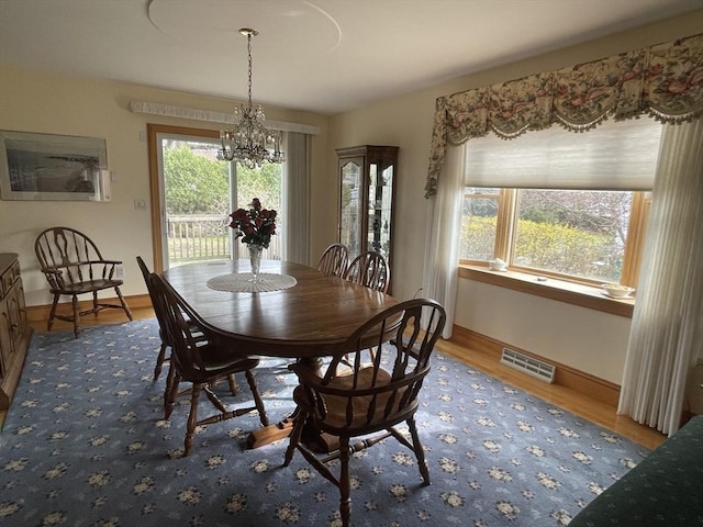 26 Feeney Rd, Norwood, MA 02062 - dining area with a chandelier, wood finished floors, and baseboards
