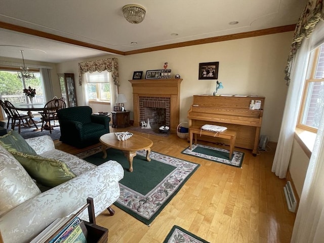26 Feeney Rd, Norwood, MA 02062 - living area with wood finished floors, crown molding, and a fireplace