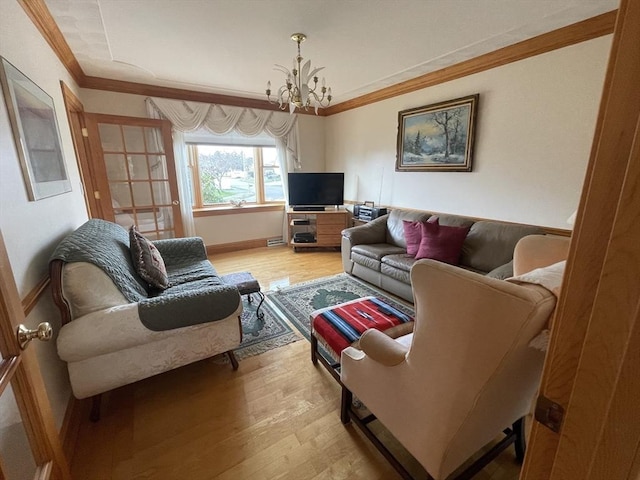 26 Feeney Rd, Norwood, MA 02062 - living area featuring a chandelier, light wood-style floors, crown molding, and baseboards
