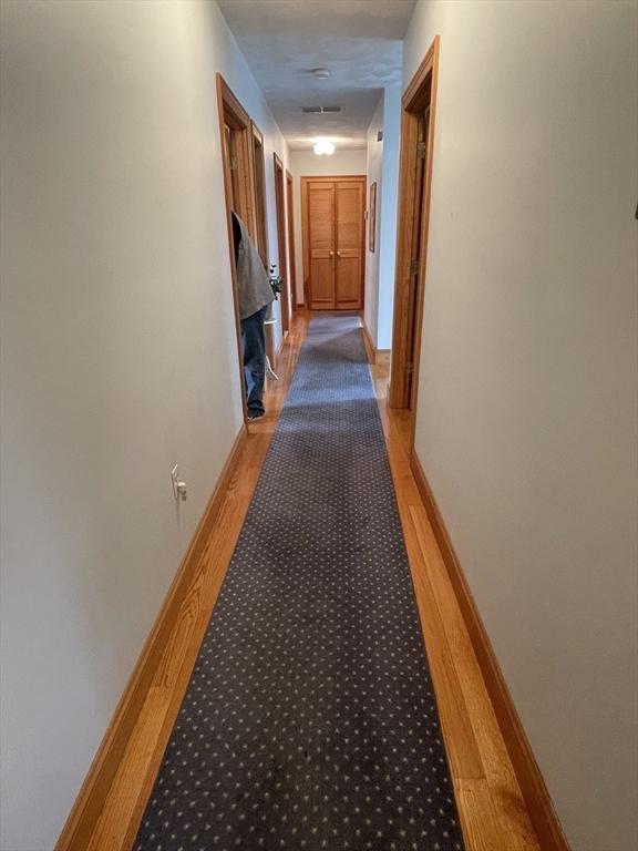 26 Feeney Rd, Norwood, MA 02062 - corridor featuring light wood-type flooring