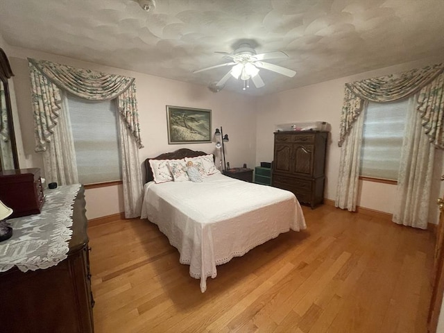 26 Feeney Rd, Norwood, MA 02062 - bedroom with light wood finished floors, baseboards, and ceiling fan