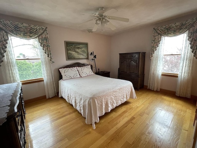 26 Feeney Rd, Norwood, MA 02062 - bedroom featuring light wood-style floors, multiple windows, and baseboards