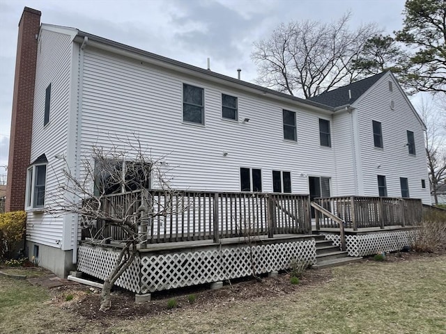 26 Feeney Rd, Norwood, MA 02062 - back of property with a wooden deck and a chimney