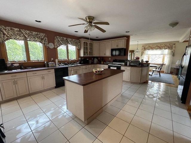 26 Feeney Rd, Norwood, MA 02062 - kitchen with black appliances, dark countertops, a sink, plenty of natural light, and recessed lighting