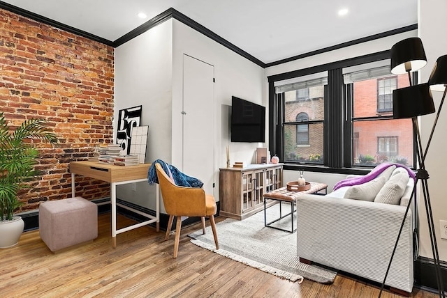 living room featuring brick wall, light wood-type flooring, and ornamental molding