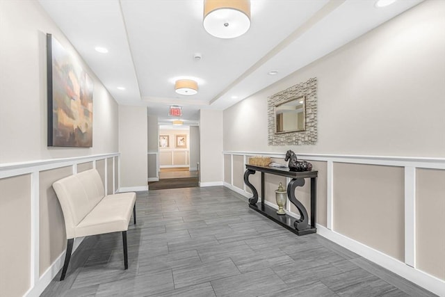321 Hammond Pond Pkwy Unit 103, Brookline, MA 02467 - hallway featuring a raised ceiling, recessed lighting, and baseboards