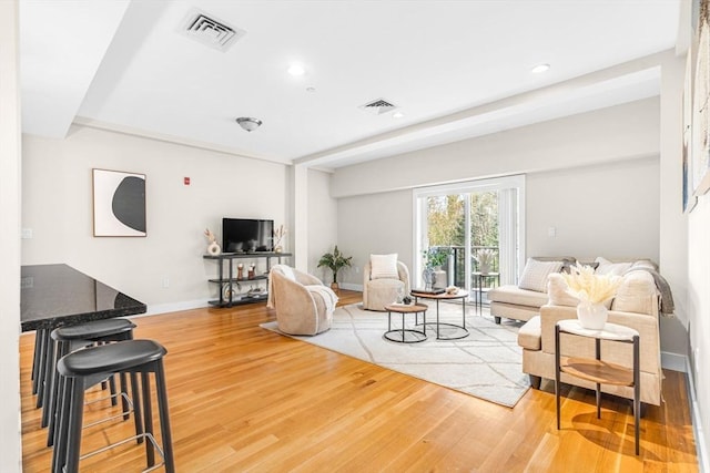 321 Hammond Pond Pkwy Unit 103, Brookline, MA 02467 - living area with wood finished floors, recessed lighting, and baseboards