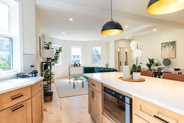 59 Dartmouth St Unit A, Somerville, MA 02145 - kitchen featuring open floor plan, light brown cabinets, light wood-style floors, light countertops, and recessed lighting