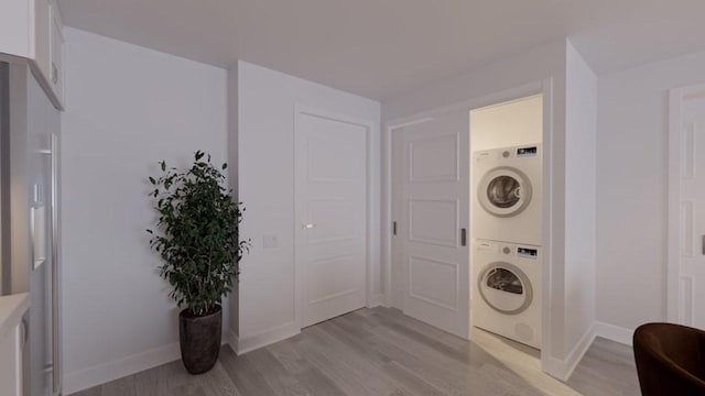 133 Salem Unit 418, Revere, MA 02151 - laundry room with estacked washer and dryer and light wood-type flooring